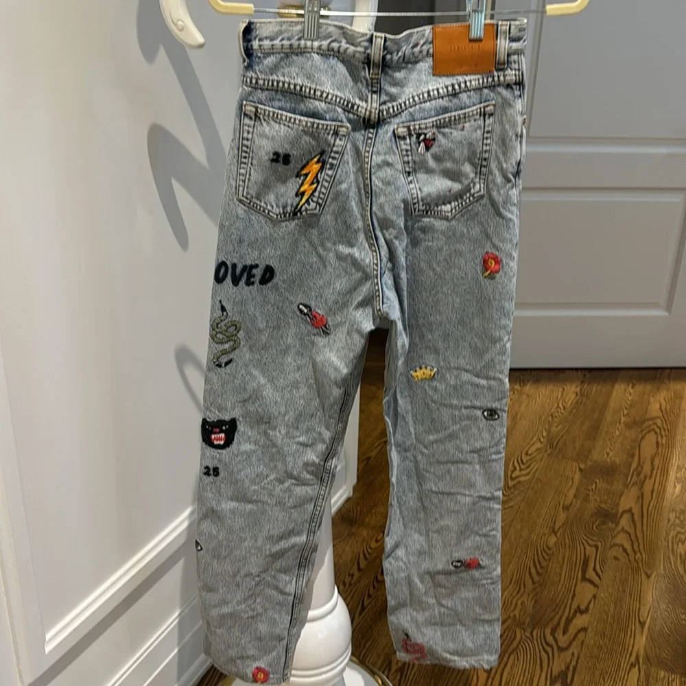 Embroidered light blue Jeans with Patches - Picture 2 of 3